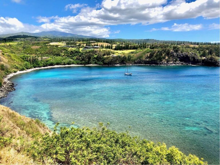 Sailboat anchored on flat day in Honolua Bay, Maui